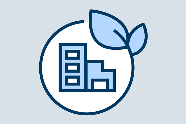 Gebäude in einem Kreis mit Blatt als Icon